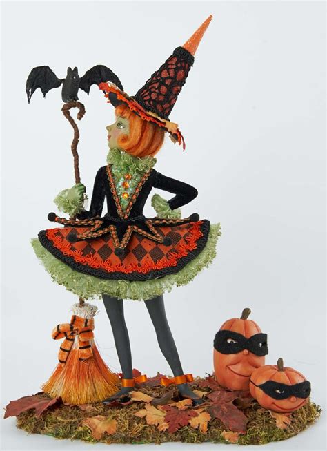 Create a Hauntingly Beautiful Halloween Display with a Witch Figurine and Stakes